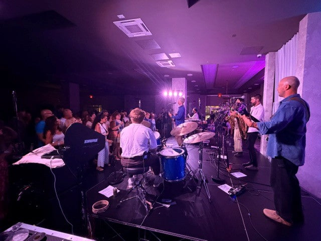 Band performing on a LimeLight portable modular stage.