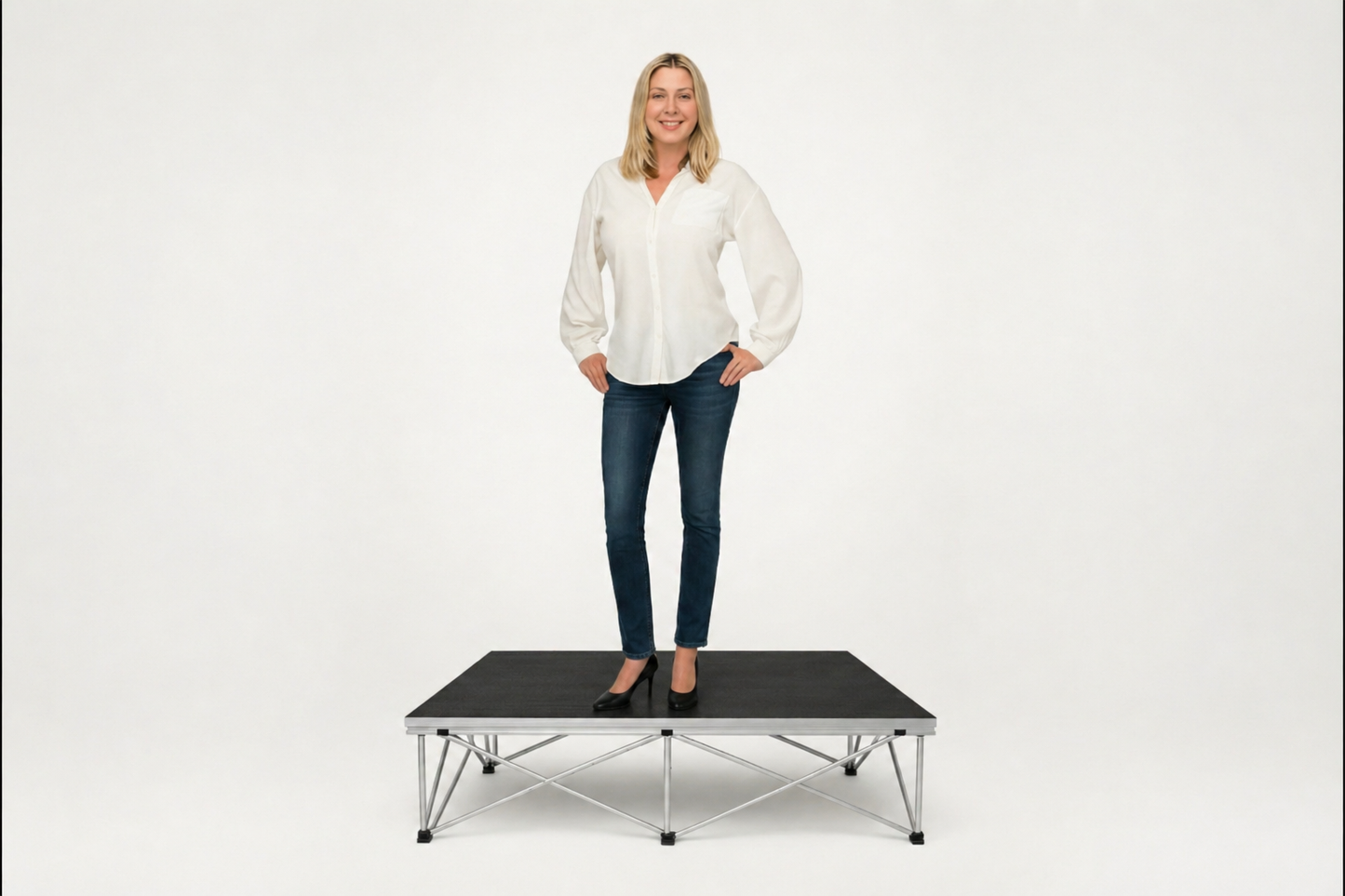 Woman standing on LimeLight portable stage platform and riser combination, 8 inches high, with black HexCoat finish.