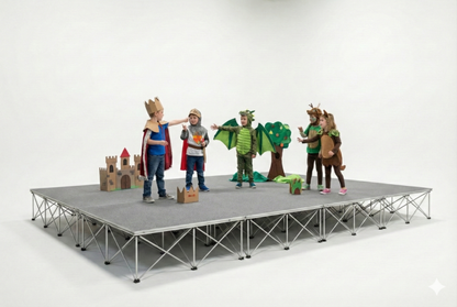 Children in costumes with props on a LimeLight Lite Series 16x12 modular stage platform in Grey Carpet at 16" height. Ideal for schools, churches, and event professionals.
