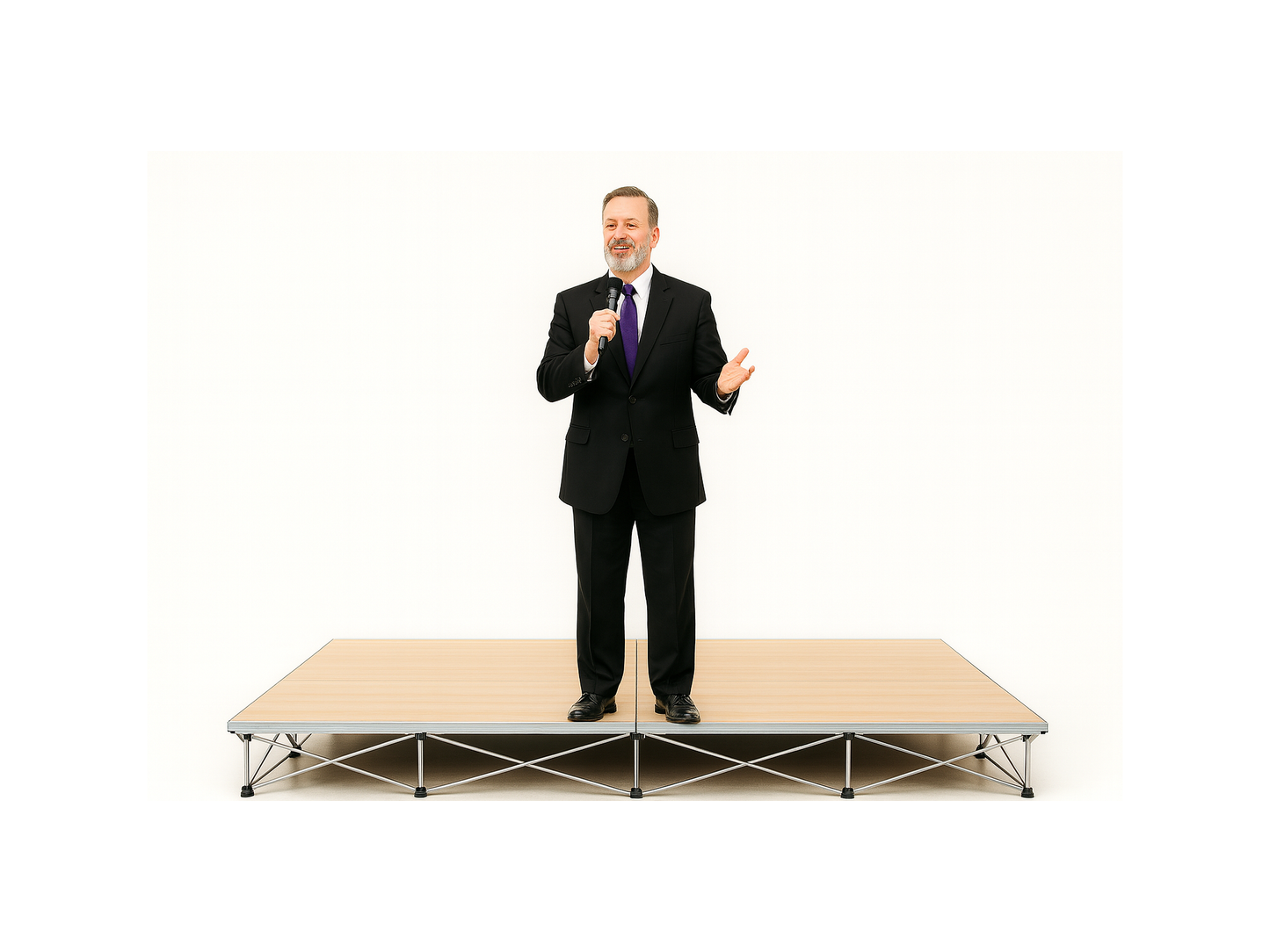 Man in a suit standing on a LimeLight Lite Series 8x8 modular stage platform in Wood Laminate at 8" height. Ideal for schools, churches, and event professionals.