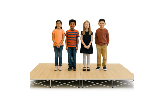 Four children standing on a LimeLight Lite Series 8x8 modular stage platform in Wood Laminate at 8" height. Ideal for schools, churches, and event professionals.