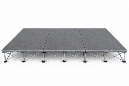 LimeLight Stages 12' x 8' modular portable stage, 8 inches high, with gray carpet finish.