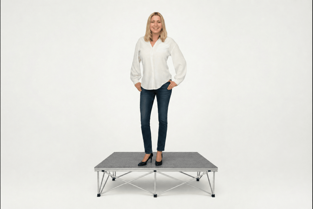 LimeLight portable stage platform and riser combination with woman, 8 inches high, with gray carpet finish.