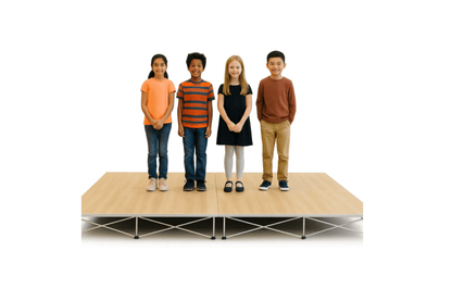 Four children standing on a LimeLight Lite Series 8x8 modular stage platform in Wood Laminate at 8" height. Ideal for schools, churches, and event professionals.
